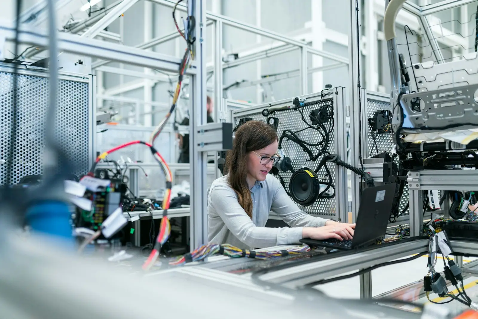 Engineer reviewing equipment on a production line